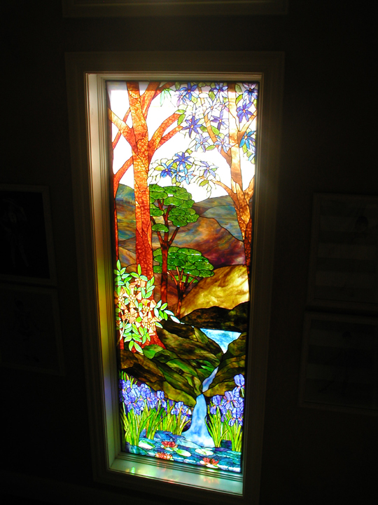 Stained glass landscape stairway landing window